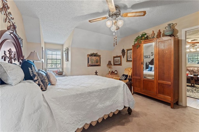 101 E Queensbury Dr, Slidell, LA 70461 - bedroom with light colored carpet, a textured ceiling, ceiling fan, and vaulted ceiling
