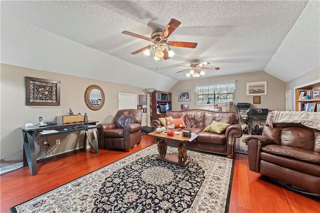 101 E Queensbury Dr, Slidell, LA 70461 - living area with lofted ceiling, a textured ceiling, a ceiling fan, and wood finished floors