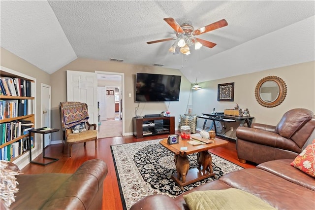 101 E Queensbury Dr, Slidell, LA 70461 - living area featuring lofted ceiling, a ceiling fan, a textured ceiling, and wood finished floors