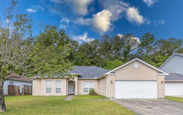 2143 Summertree Dr, Slidell, LA 70460 - view of front of house featuring a garage, stucco siding, asphalt driveway, and roof with shingles