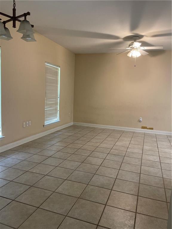 2143 Summertree Dr, Slidell, LA 70460 - spare room with light tile patterned floors and ceiling fan