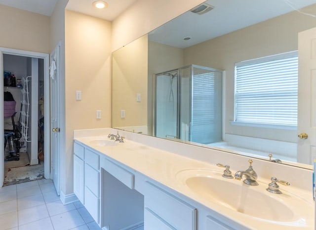2143 Summertree Dr, Slidell, LA 70460 - bathroom with a stall shower, a spacious closet, tile patterned flooring, and double vanity
