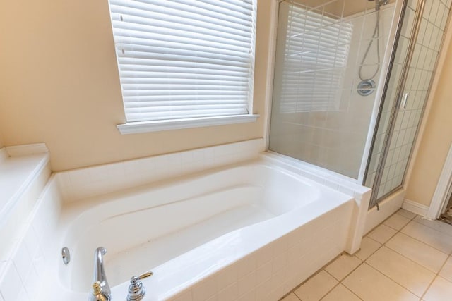 2143 Summertree Dr, Slidell, LA 70460 - bathroom with a garden tub, a stall shower, and tile patterned floors