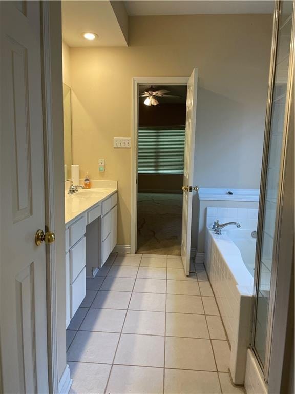 2143 Summertree Dr, Slidell, LA 70460 - bathroom with vanity, tile patterned flooring, a garden tub, and ceiling fan