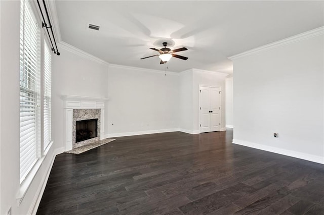 386 Knollwood Ln, Slidell, LA 70458 - unfurnished living room with healthy amount of natural light, ceiling fan, dark wood-type flooring, a high end fireplace, and crown molding