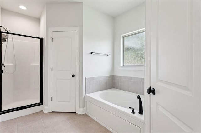 386 Knollwood Ln, Slidell, LA 70458 - full bath featuring a garden tub, a shower stall, and tile patterned flooring