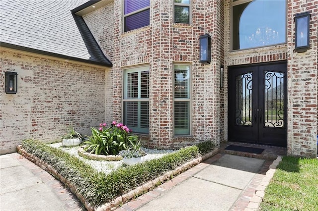 172 River Oaks Dr, La Place, LA 70068 - property entrance featuring french doors and brick siding