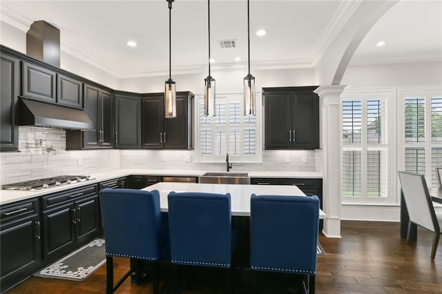 172 River Oaks Dr, La Place, LA 70068 - kitchen featuring under cabinet range hood, stainless steel gas stovetop, light countertops, tasteful backsplash, and recessed lighting