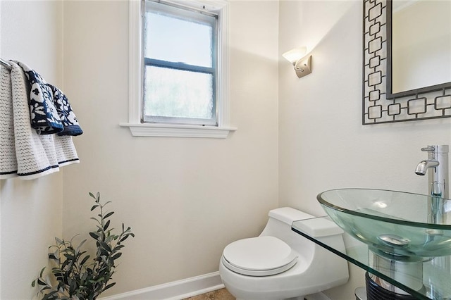 5237 Meadowdale St, Metairie, LA 70006 - half bathroom with a sink and toilet