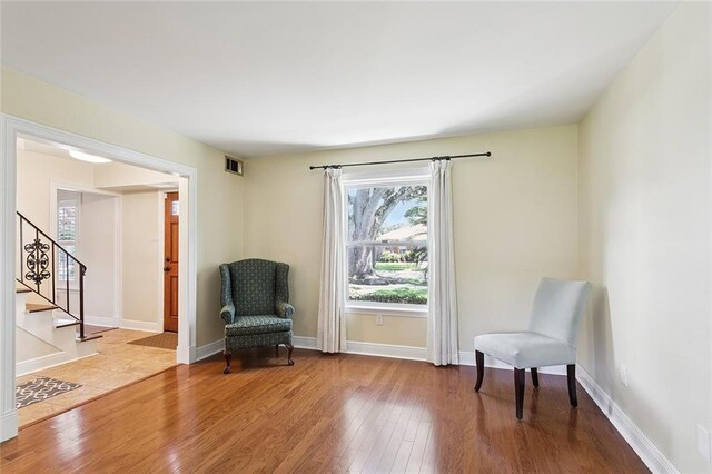 5237 Meadowdale St, Metairie, LA 70006 - sitting room featuring hardwood / wood-style flooring, healthy amount of natural light, and stairs