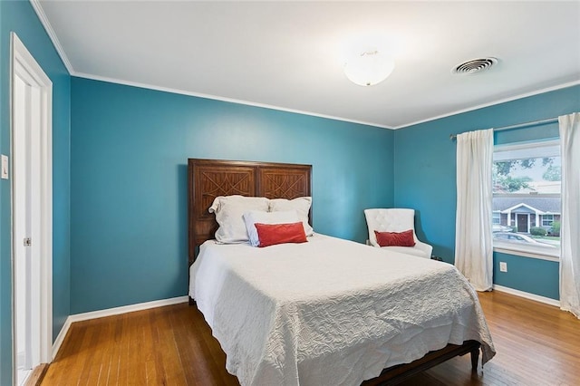 5237 Meadowdale St, Metairie, LA 70006 - bedroom with wood finished floors and crown molding