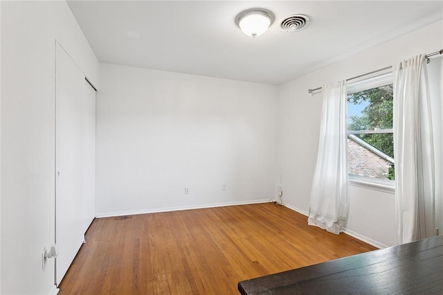 5237 Meadowdale St, Metairie, LA 70006 - unfurnished bedroom with wood finished floors and baseboards