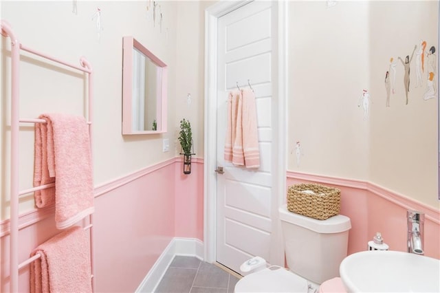 1932 Lapeyrouse St, New Orleans, LA 70116 - bathroom with toilet and tile patterned flooring