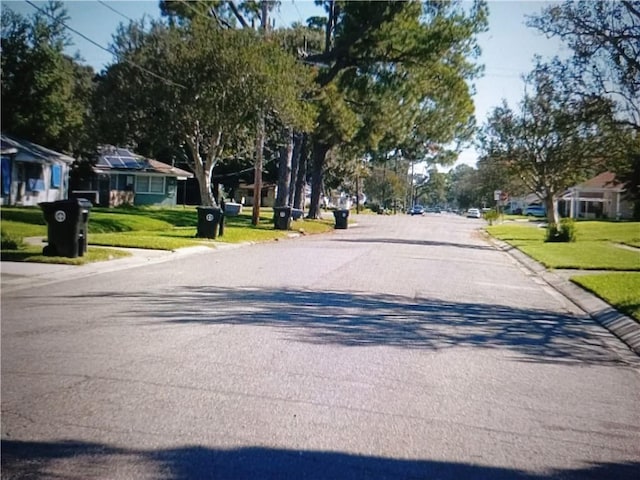 4101 Stephen Girard Ave, New Orleans, LA 70126 - view of asphalt road featuring curbs and a residential view