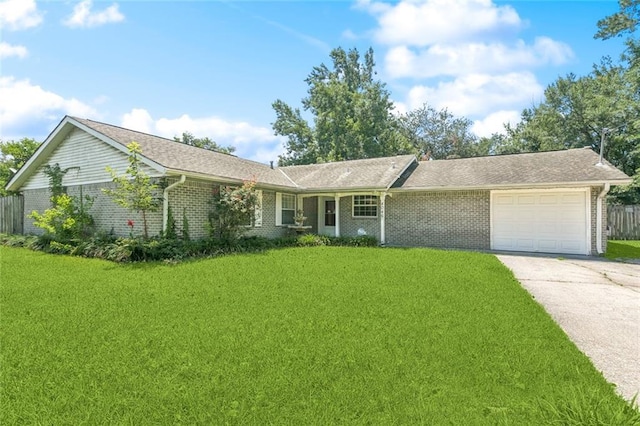 4046 Riviera Dr, Slidell, LA 70458 - ranch-style home with a garage, brick siding, concrete driveway, and a front yard