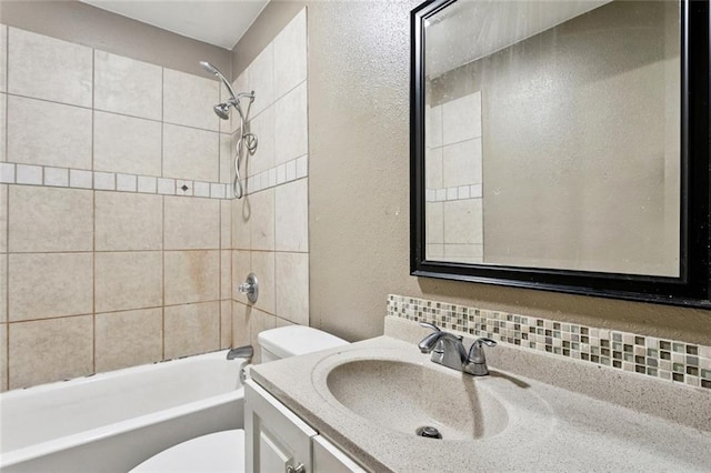 4046 Riviera Dr, Slidell, LA 70458 - bathroom with a textured wall, vanity, shower / bathtub combination, and tasteful backsplash