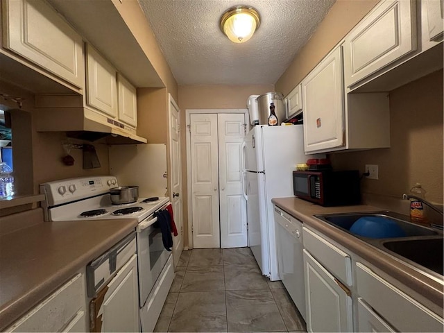 4325 Loire Dr, Kenner, LA 70065 - kitchen featuring white appliances, under cabinet range hood, a textured ceiling, white cabinetry, and light countertops