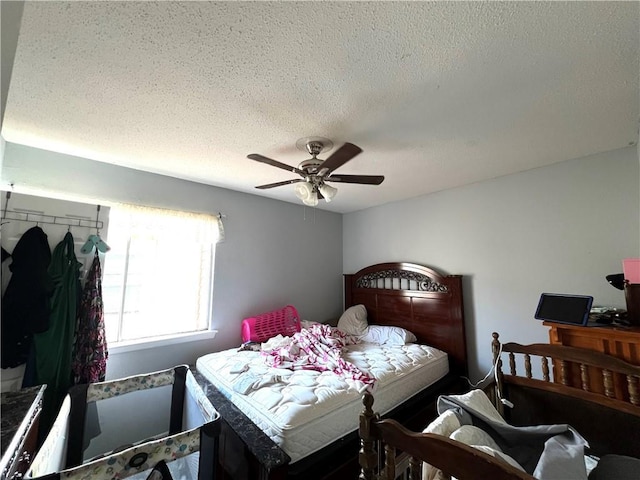 4325 Loire Dr, Kenner, LA 70065 - bedroom with a textured ceiling and ceiling fan