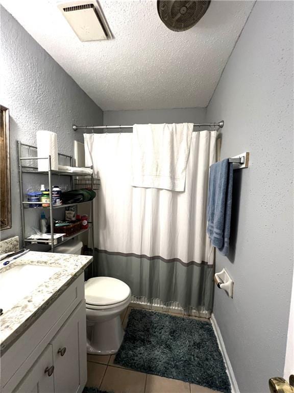 4325 Loire Dr, Kenner, LA 70065 - full bathroom with a textured ceiling, vanity, tile patterned floors, a shower with shower curtain, and a textured wall