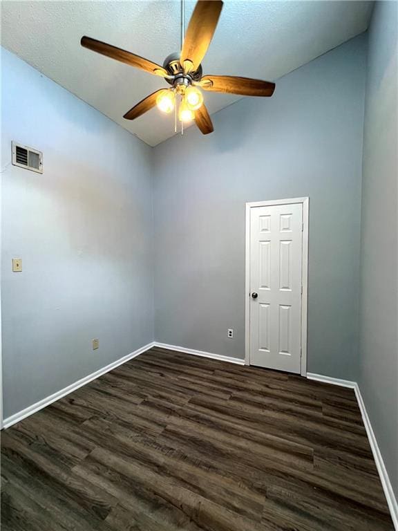 4325 Loire Dr, Kenner, LA 70065 - spare room with a ceiling fan, lofted ceiling, and dark wood-style floors