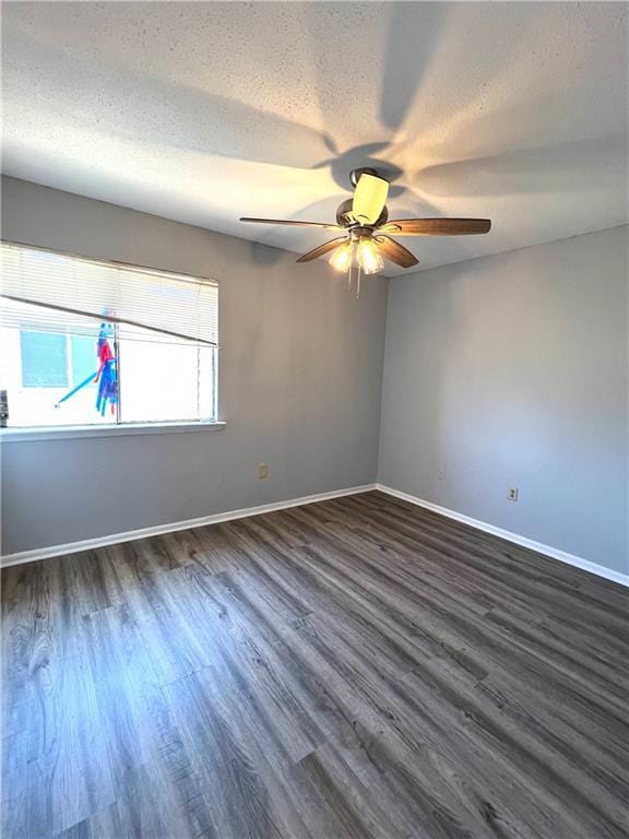 4325 Loire Dr, Kenner, LA 70065 - empty room featuring a textured ceiling, a ceiling fan, and dark wood-style floors