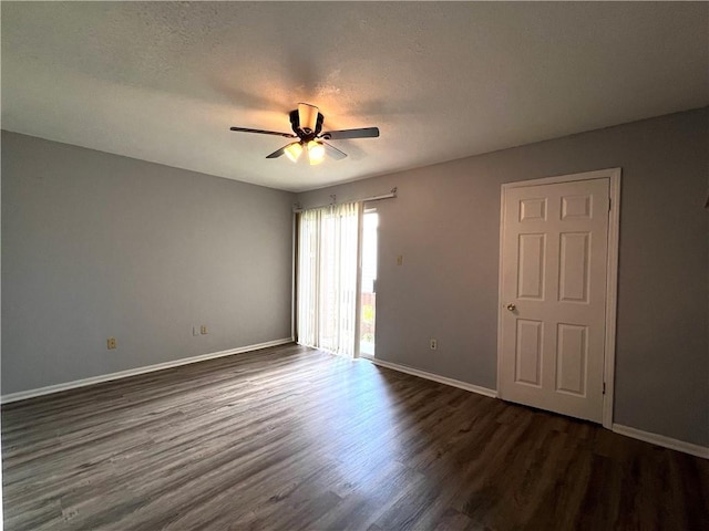4325 Loire Dr, Kenner, LA 70065 - unfurnished room featuring dark wood-style flooring, a ceiling fan, and a textured ceiling