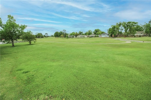 2137 Carmel Valley Dr, La Place, LA 70068 - view of community with golf course view and a yard