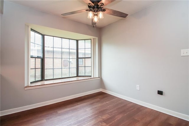 2137 Carmel Valley Dr, La Place, LA 70068 - empty room featuring healthy amount of natural light, dark wood finished floors, and a ceiling fan
