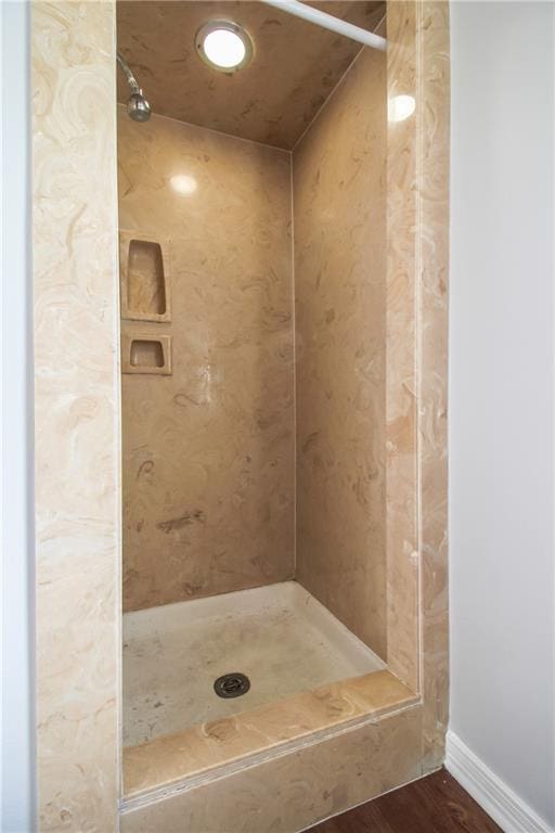2137 Carmel Valley Dr, La Place, LA 70068 - bathroom featuring a shower and wood finished floors