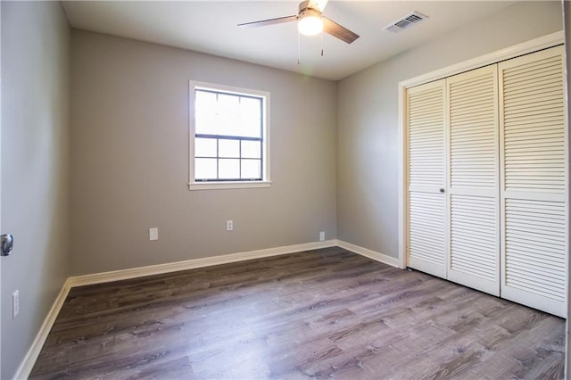 2137 Carmel Valley Dr, La Place, LA 70068 - unfurnished bedroom featuring wood finished floors, a closet, and ceiling fan