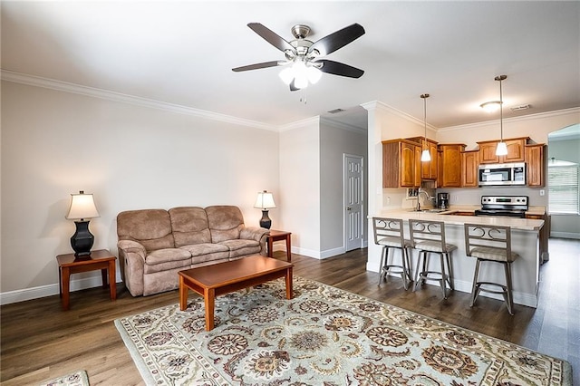 1404 Windsor St Unit 1A, La Place, LA 70068 - living room with ceiling fan, ornamental molding, and dark wood-style floors
