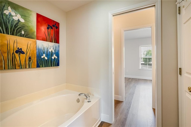 1404 Windsor St Unit 1A, La Place, LA 70068 - bathroom with a bath and wood finished floors