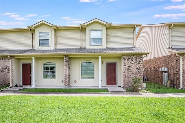 1404 Windsor St Unit 1A, La Place, LA 70068 - multi unit property with a front lawn, a shingled roof, and stucco siding