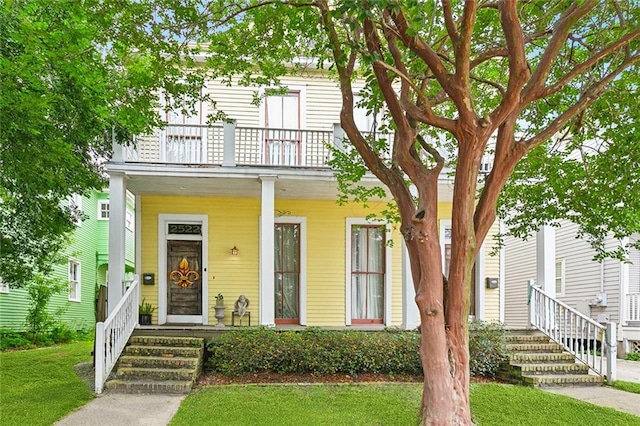 252224 General Pershing St, New Orleans, LA 70115 - view of front of home with a balcony, a porch, and a front yard