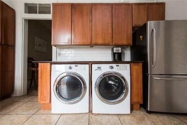 252224 General Pershing St, New Orleans, LA 70115 - washroom featuring light tile patterned floors and washer and clothes dryer