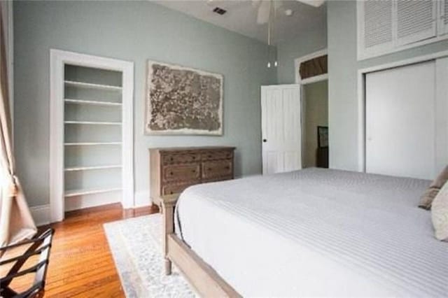 252224 General Pershing St, New Orleans, LA 70115 - bedroom featuring light wood-type flooring and ceiling fan