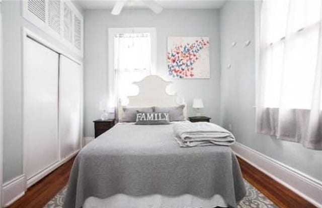 252224 General Pershing St, New Orleans, LA 70115 - bedroom with dark wood finished floors, a closet, and ceiling fan