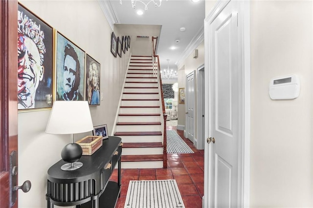 1230 Antonine St, New Orleans, LA 70115 - entryway featuring stairway, ornamental molding, dark tile patterned flooring, and a chandelier