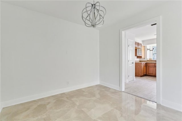 11100 N Idlewood Ct, New Orleans, LA 70128 - spare room with a chandelier and light marble finish flooring
