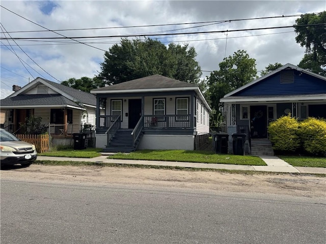 9025 Hickory St, New Orleans, LA 70118 - view of front of house with covered porch