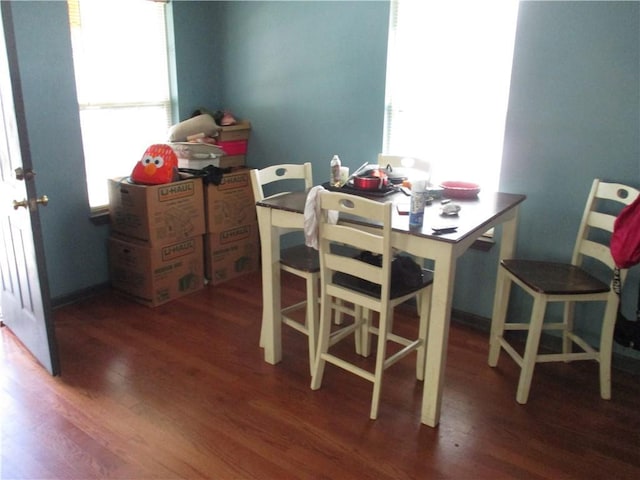 9025 Hickory St, New Orleans, LA 70118 - dining area featuring wood finished floors and plenty of natural light