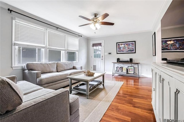 432 Emerald St, New Orleans, LA 70124 - living area featuring ceiling fan, wood finished floors, and ornamental molding