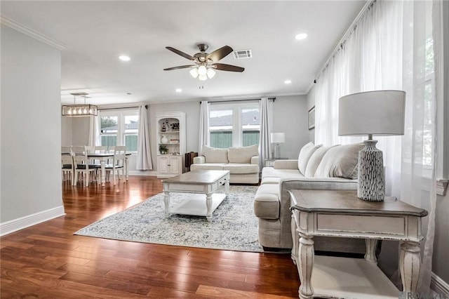 432 Emerald St, New Orleans, LA 70124 - living area featuring ornamental molding, ceiling fan, dark wood-type flooring, and recessed lighting