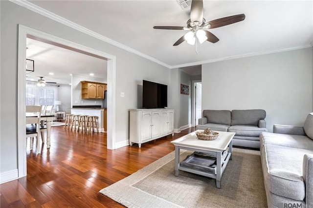 432 Emerald St, New Orleans, LA 70124 - living room featuring ceiling fan, dark wood finished floors, and ornamental molding
