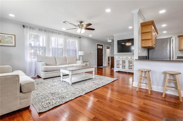 432 Emerald St, New Orleans, LA 70124 - living room featuring a ceiling fan, ornamental molding, wood finished floors, and recessed lighting