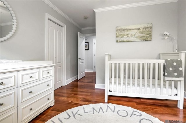 432 Emerald St, New Orleans, LA 70124 - bedroom with dark wood-type flooring, ornamental molding, and a nursery area