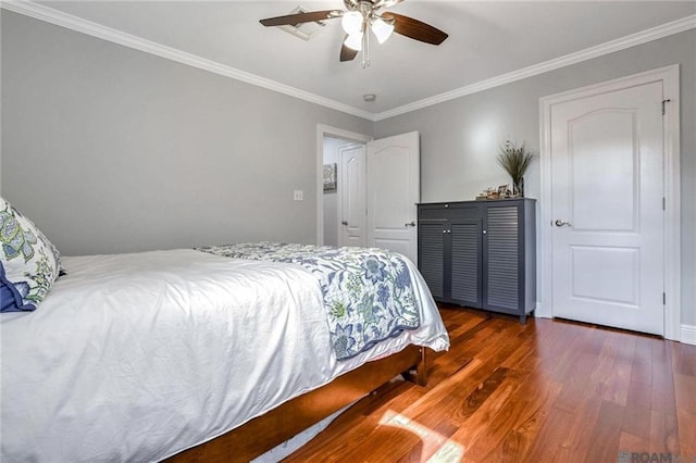 432 Emerald St, New Orleans, LA 70124 - bedroom with wood finished floors, ornamental molding, and ceiling fan