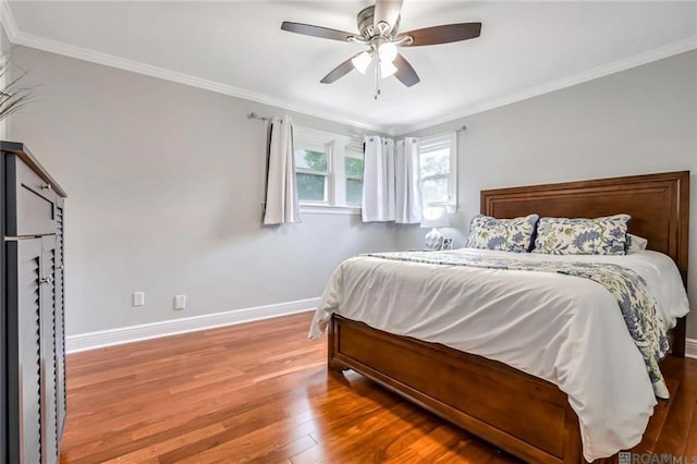 432 Emerald St, New Orleans, LA 70124 - bedroom with wood finished floors, crown molding, and a ceiling fan