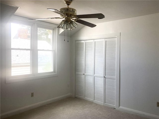 704 General Pershing St Unit 704, New Orleans, LA 70115 - unfurnished bedroom featuring multiple windows, carpet, a closet, and a ceiling fan