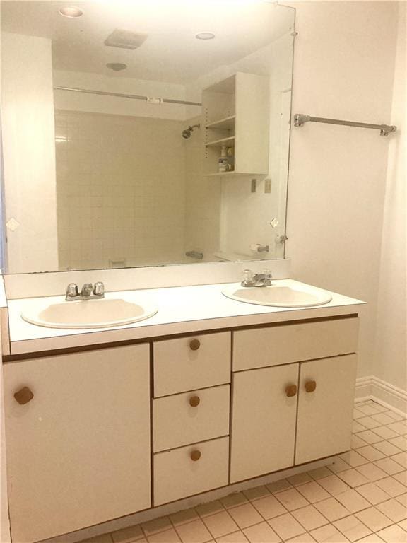 704 General Pershing St Unit 704, New Orleans, LA 70115 - full bathroom featuring double vanity, tile patterned floors, and a shower